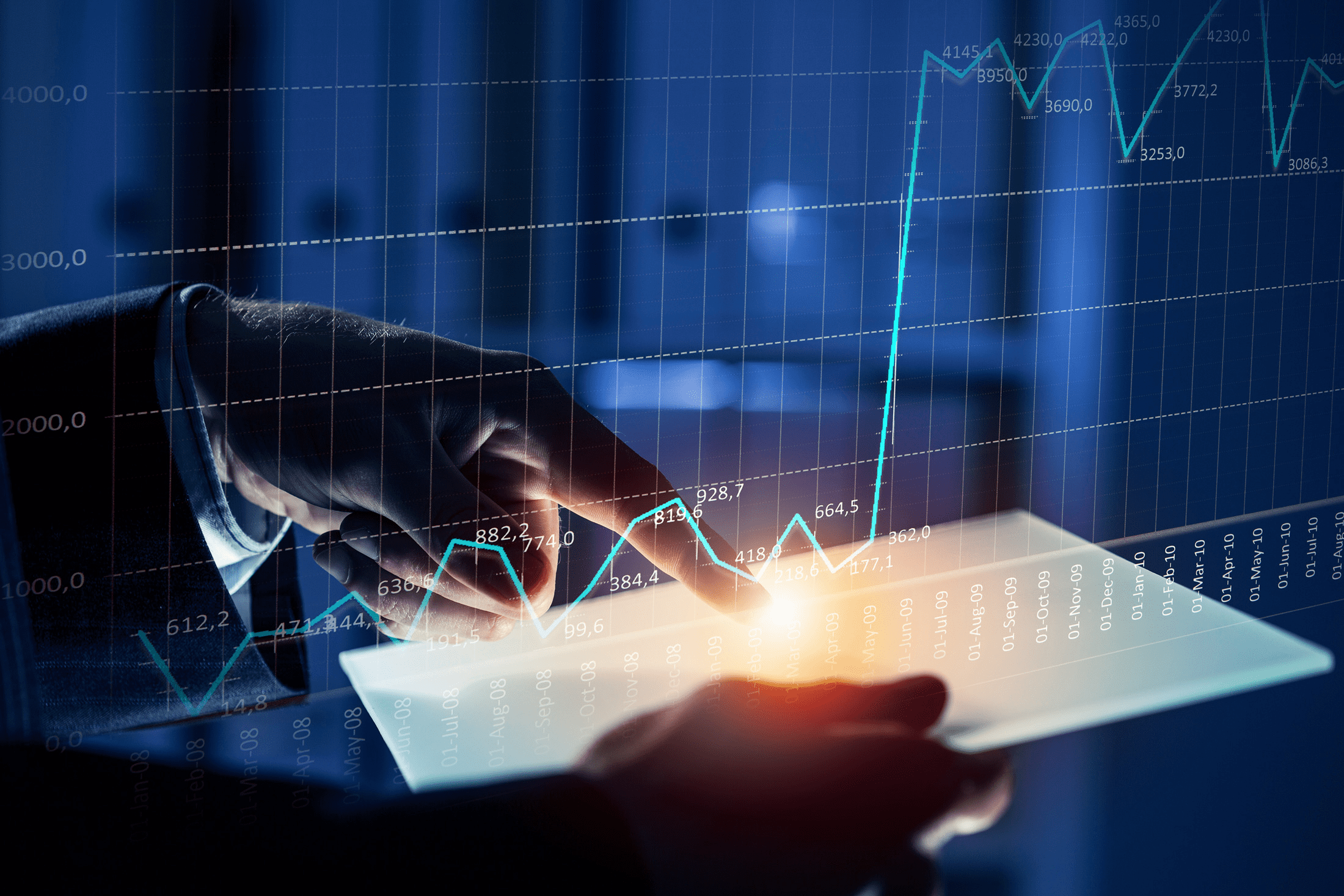 man pointing at a tablet with a graph and numbers showing growth